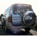 כיסוי גלגל אחורי לרכב מיצובישי פג'רו 2001-2007  טבעת חיצונית נירוסטה צלחת פנימית ABS בצבעים שונים 